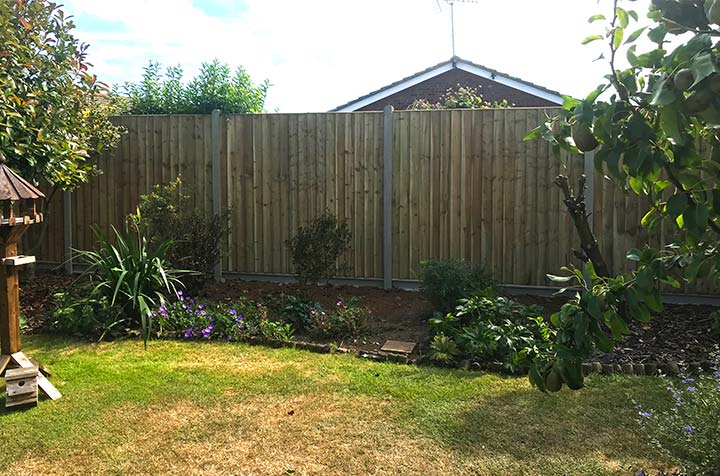 Wooden Fencing With Stone Fence Posts